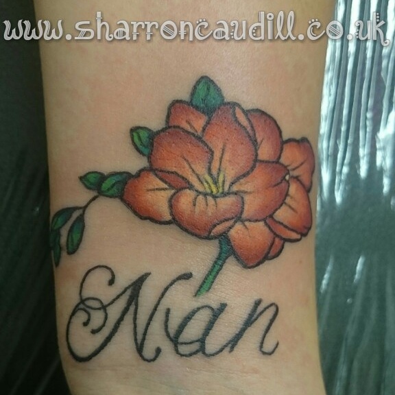 flower wrist tattoo image
